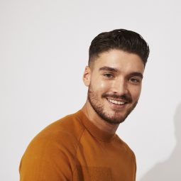 Man with brown hair in messy quiff