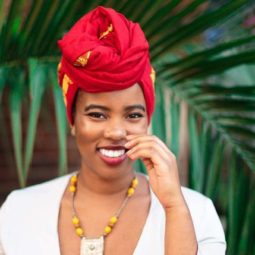 The Day I Went Natural: Shot of Dr. Alexandra Oti wearing a headwrap and posing outside