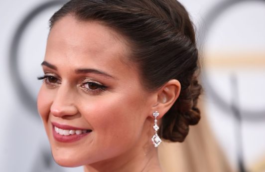 swedish actress alicia vikander at the 2016 golden globe awards with her dark hair in an updo