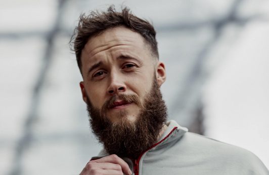 Man with short haircut and shaped beard