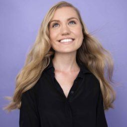 front view image of a woman with long wavy blonde hair - volume hair