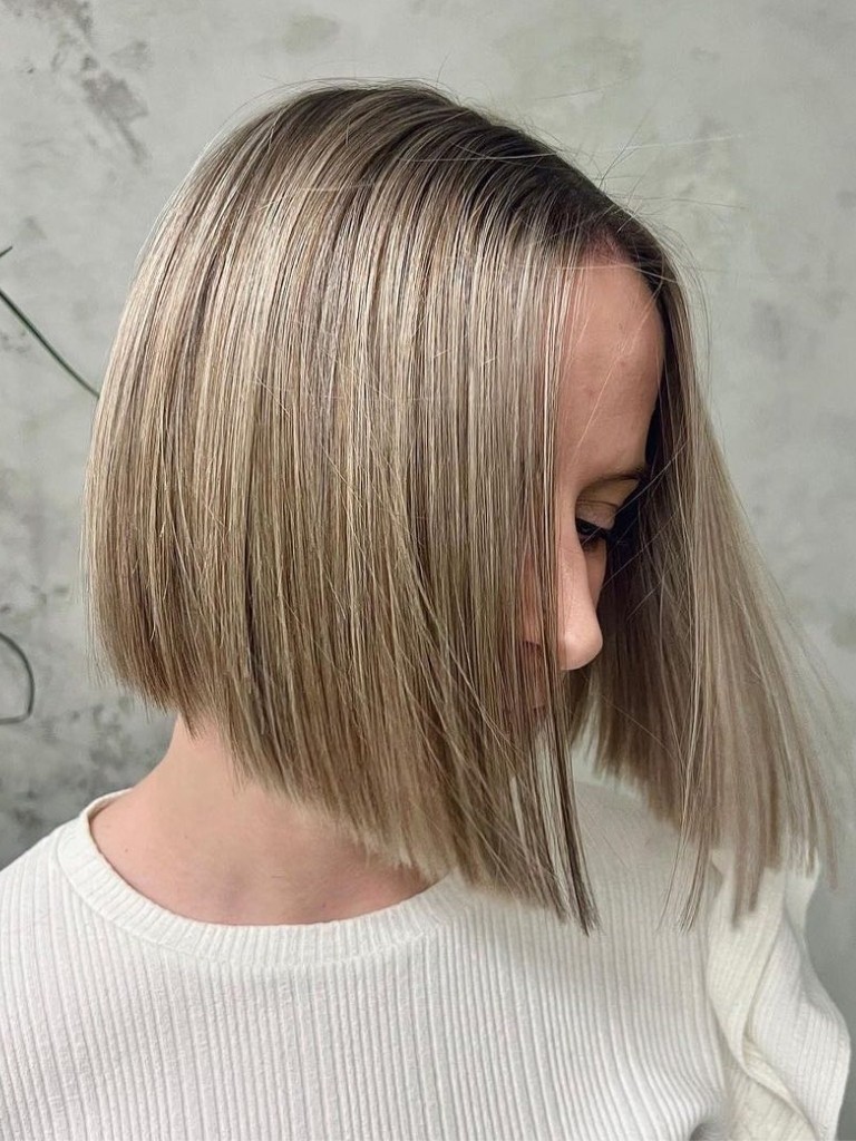 Woman with a blonde graduated bob