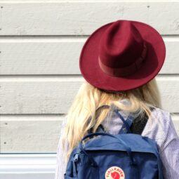 Girl in school with backpack