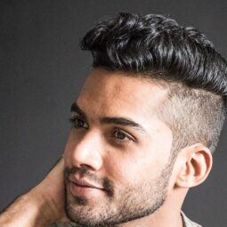 man with a faded undercut hairstyle looking away from the camera