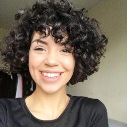 brunette woman with a voluminous curly bob