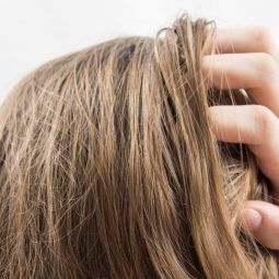 Woman touching her hair