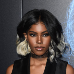 close up shot of diamond white with black and silver blonde ombre hairstyle, wearing all black on the red carpet