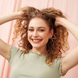 Women with curly natural blonde long hair