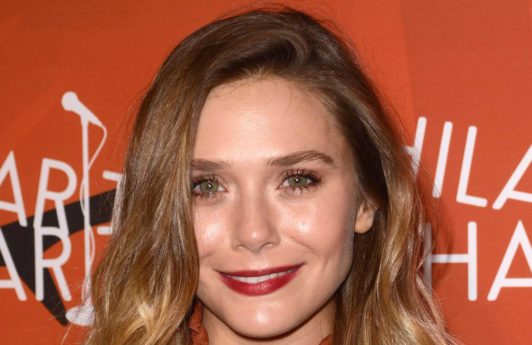 dark hair with highlights: All Things Hair - IMAGE - Elizabeth Olsen long wavy hair