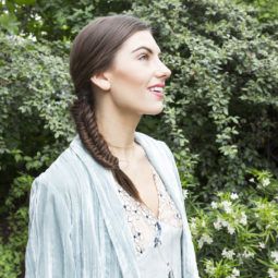 Fishtail plait brunette girl outside with braid