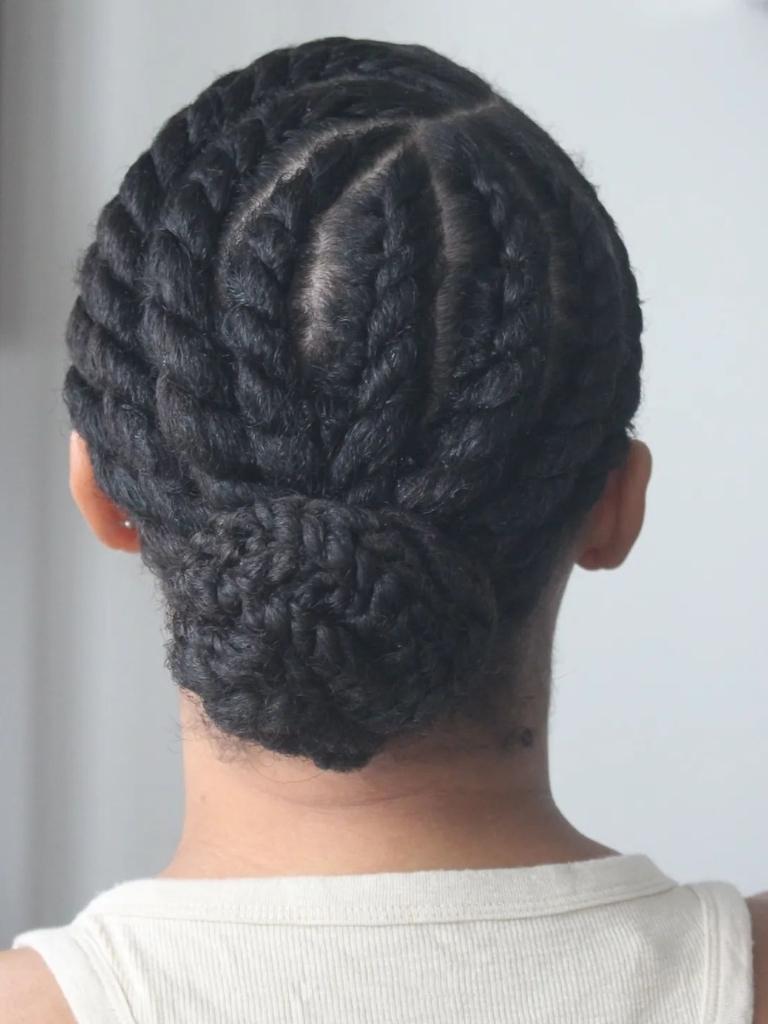 Woman with flat twist low bun