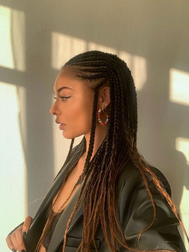 Woman in profile with beautifully woven Fulani braids