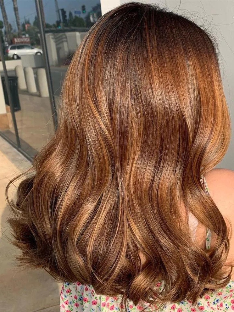 Woman with glossy chestnut hair