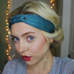 updos for short hair: close up of a blonde woman wearing a teal blue headband with her hair in a tucked updo