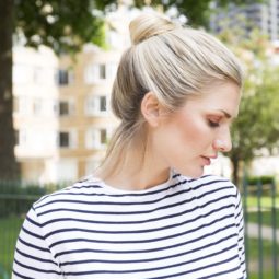 model with blonde hair styled in a high bun easy updo