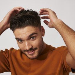 Man with short swept back messy quiff