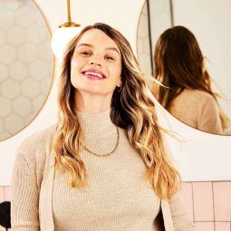 Woman with healthy, bouncy hair smiling