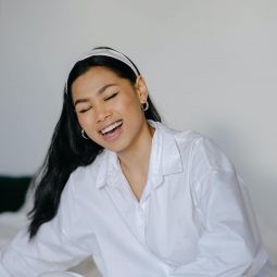 Asian woman with long hair smiling