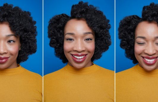 Flexi rods on natural hair girl smiling with afro hair