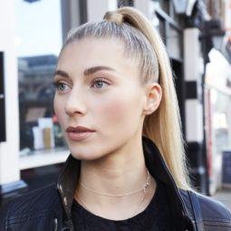 Woman standing outside with high ponytail