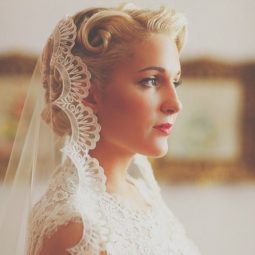 Vintage wedding hairstyles - blonde hair under a veil with retro pin curls