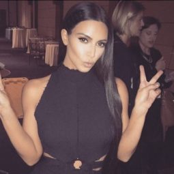 hairstyles for long straight hair: Kim Kardashian Instagram picture of her wearing a black dress with long straight hair