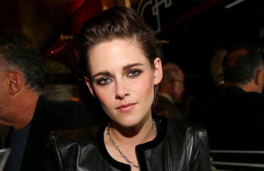 kristen stewart wearing an all black outfit with short brunette hair