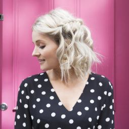 Blonde with a short wavy bob in a waterfall braid