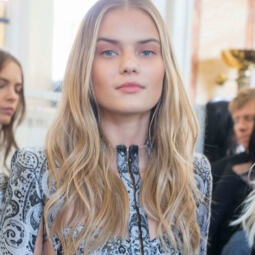 backstage model with blonde hair and barely-there waves