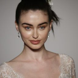 simple wedding hairstyles: model with sleek updo on the runway