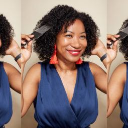 World Afro Day: A young black woman with natural hair and afro pick