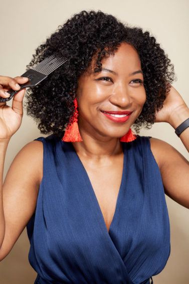 World Afro Day: A young black woman with natural hair and afro pick