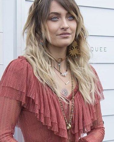 close up shot of paris jackson with crystal hair crown, wearing pink dress