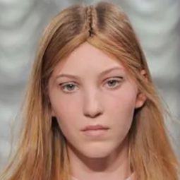 Dark blonde model with braid down her centre parting - indigitalimages