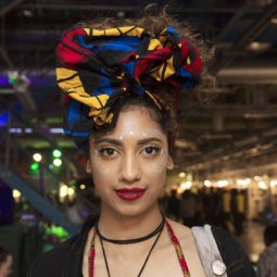 front shot of model with pineapple scarf updo at afropunk