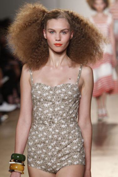 Marc Jacobs SS11 model with brown frizzy hair with side parting on catwalk