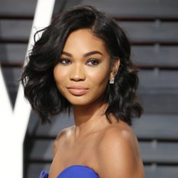 a woman with short wavy hair looking side view