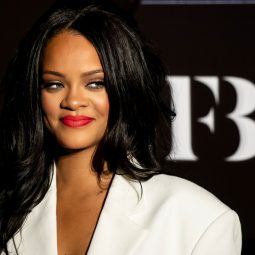 Rihanna with dark brown long weave