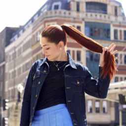 Thick red haired woman with ponytail