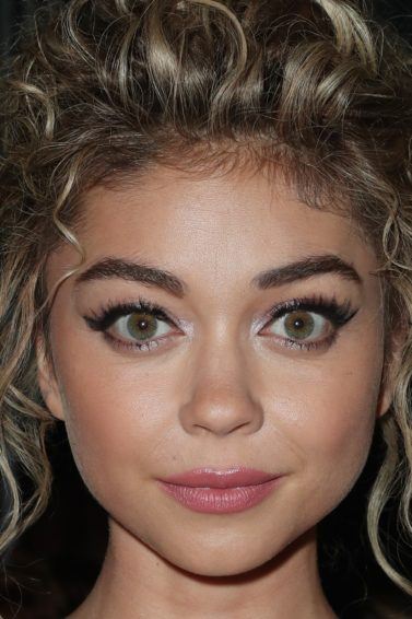 sarah hyland with blonde messy updo on the red carpet