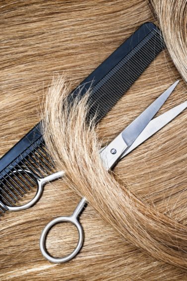 blonde hair with hair scissors and fine tooth comb