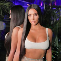 shampoo for straight hair: close up shot of kim kardashian west with the long straight hair, wearing sports bra and dress at the balmain and beats by dre event