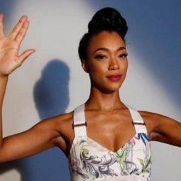 close up shot of star trek: discovery star with vintage updo hairstyle, wearing corset top