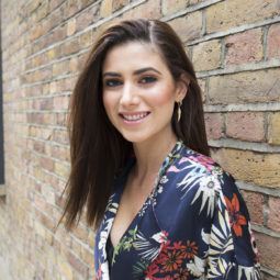 how to straighten hair without heat: model outside smiling wearing floral outfit