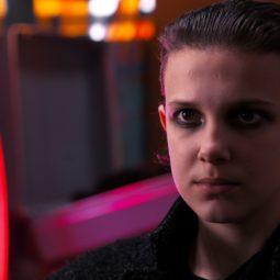 Stranger Things 2: Eleven with short slicked-back hair, wearing dark eye shadow