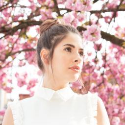 Woman with brunette hair in a topknot bun