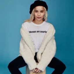 Zoe Kravitz sat on a stool wearing a black beret over her blonde box braids