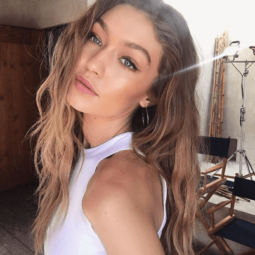 selfie of model gigi hadid with blonde bronde hair with darker hair shadowing at her roots