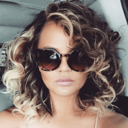 1980s hairstyles Chrissy Teigen new curly hair