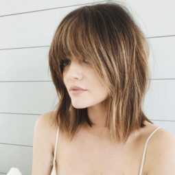 pretty little liars actress lucy hale with a shaggy brunette cut and soft full bangs